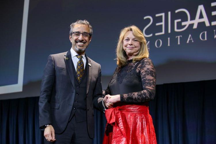 ADEA President and CEO Dr. Karen West congratulates Dr. Nader A. Nadershahi. (photo courtesy of ADEA)